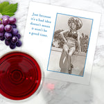 The Good Time Napkin by Shannon Martin Design features a vintage photo of a smiling woman in a swimsuit and sunhat, plus the phrase, “Just because it’s a bad idea doesn’t mean it won’t be a good time.”.