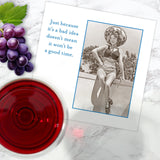 The Good Time Napkin by Shannon Martin Design features a vintage photo of a smiling woman in a swimsuit and sunhat, plus the phrase, “Just because it’s a bad idea doesn’t mean it won’t be a good time.”.