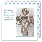 The Good Time Napkin by Shannon Martin Design features a vintage photo of a smiling woman in a swimsuit and sunhat with retro text, "Just because it’s a bad idea doesn’t mean it won’t be a good time," framed by blue daisies.