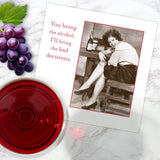 A greeting card features a vintage photo of a laughing woman with wine and bottles, captioned: “You bring the alcohol, I'll bring the bad decisions.” Pair it with Shannon Martin Design’s Bad Decisions Napkin for your next toast!.