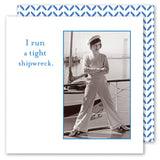 The Tight Shipwreck Napkin by Shannon Martin Design features a black-and-white photo of a woman in nautical attire with the phrase “I run a tight shipwreck” and a blue-and-white patterned border—perfect for pairing with funny vintage napkins.