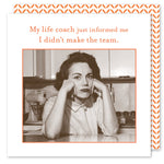 A sepia-toned image shows a woman at a kitchen table with Shannon Martin Designs biodegradable Life Coach Beverage Napkins, looking contemplative. Above her, the text reads, My life coach just informed me I didn’t make the team.