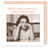 A sepia-toned image shows a woman at a kitchen table with Shannon Martin Designs biodegradable Life Coach Beverage Napkins, looking contemplative. Above her, the text reads, My life coach just informed me I didn‚Äôt make the team.