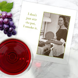 The Stir The Pot Napkin by Shannon Martin Design features a vintage photo of a smiling woman cooking and the phrase, “I don’t just stir the pot, I smoke it.” Biodegradable, perfect for wine and grapes on a marble surface.