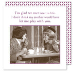 Two women enjoy a vintage-style moment at a diner table with coffee and sandwiches on biodegradable napkins. The text reads, Im glad we met later in life. I dont think my mother would have let me play with you. - Glad We Met Beverage Napkin by Shannon Martin Design.