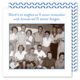 A group of friends laugh together in a black-and-white photo. The Shannon Martin Design "Here's To Nights Napkin" featuring vintage characters and the quote “Here’s to nights we’ll never remember with friends we’ll never forget” completes the scene.