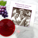 The Stick Around Napkin by Shannon Martin Design features a vintage image of smiling women at a picnic with the quote, “Stick around. I may need someone to blame.” Biodegradable and perfect for drinks on any marble surface.