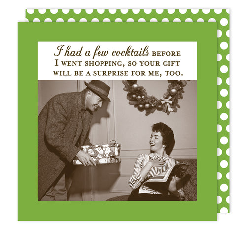 A vintage-style photo of a man giving a gift to a smiling woman under a wreath. Above, the text reads: “I had a few cocktails before I went shopping, so your hostess gifts will be a surprise for me, too.” Surprise Holiday Napkin by Shannon Martin Design.