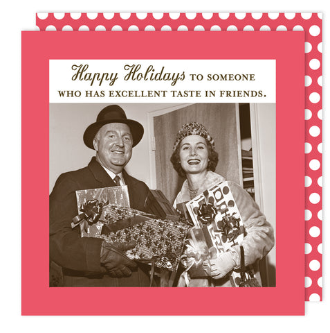 A vintage photo of a smiling couple in winter attire holding gifts, with "Happy Holidays to someone who has excellent taste in friends" above. Features festive party napkins from the Excellent Taste Holiday Napkin by Shannon Martin Design.