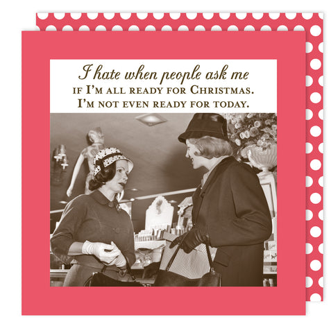 Two women in vintage attire chat under the message: “I hate when people ask me if I’m all ready for Christmas.” With a red polka dot border, the Ready Holiday Napkin by Shannon Martin Design is perfect for eco-friendly parties.