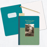 The Take Flight Journal by Shannon Martin Design is a jewel-toned, lined notebook with a vintage aviator woman, gold foil details, and "Spread your wings, let your dreams take flight" on the cover. Includes an open teal notebook, pencil, and ticket stub.
