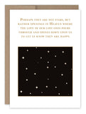 The "Stars In Heaven Sympathy Card" by Shannon Martin Design is crafted on recycled paper and features a gold-embossed quote about stars representing openings in heaven. Below the quote is an illustration of a night sky dotted with scattered stars, and it comes with a brown envelope for conveying your condolences.