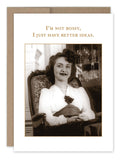The "I'm Not Bossy What A Hoot Card" from Shannon Martin Design is a vintage-style greeting card made in the USA. It features a sepia-toned photograph of a woman smiling in a chair and is crafted from recycled paper. The card displays the text: "I'm not bossy, I just have better ideas.