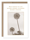 The Memory Treasure Sympathy Card by Shannon Martin Design is sepia-toned with illustrations of tall dandelions and fern, printed on recycled paper. The card features the text, "When someone you love becomes a memory, the memory becomes a treasure.