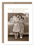 Two women in vintage clothing stand close together, smiling warmly in front of an old car that evokes cherished vintage photos. Above them is the message: "I love you for what you are. (Older than me.)" Happy Birthday! This charming scene is featured on the What You Are Birthday Card by Shannon Martin Design.