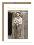 The "Do No Harm Birthday Card" by Shannon Martin Design showcases a vintage-style photograph printed on recycled paper. It features an individual dressed as a cowboy in front of a wooden building, holding a rifle, with the bold text above reading, "Do no harm, but take no crap." This card is perfect for celebrating a badass birthday.
