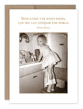 A vintage sepia-toned card from Shannon Martin Design features a young girl in a dress, standing on a chair at the kitchen sink and confidently wearing high heels. The card includes the quote: "Give a girl the right shoes, and she can conquer the world." - Marilyn Monroe. Perfect for celebrating a birthday, this charming card is crafted on recycled paper.