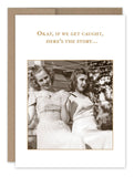 Two women in vintage dresses sit outdoors, smiling as if posing for a retro photo. Above them, the text reads, "Okay, if we get caught, here's the story..." The scene is reminiscent of a sunny day on a porch or in a yard. This charming moment is captured in the **Get Caught Birthday Card** by **Shannon Martin Design**.
