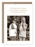 The "Know Better Birthday Card" by Shannon Martin Design showcases a USA-made vintage-style photo. The image features a woman in sunglasses and a sleeveless top standing beside a smiling girl in a striped shirt, with both positioned near a wooden railing. The text above them reads: "I'm starting to think I'll never be old enough to know any better.