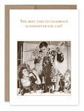 A vintage-style image of three people at a party, adorned with streamers. In the center, a joyful man holds a drink while two women on either side are laughing. The text above them reads, "The best time to celebrate is whenever you can!" This design is from Shannon Martin Design and is printed on FSC-certified recycled paper as part of the Celebrate Whenever Congratulations Card collection.