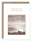 Introducing the Beautiful Soul Sympathy Card by Shannon Martin Design: This card captures the charm of vintage photography with a sepia-toned image of a sunset behind clouds and birds in flight, printed on recycled paper. Proudly made in the USA, it features the heartfelt message, "A beautiful soul is never forgotten.