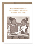 Two children are perched on a couch, grinning at one another with an open book on their laps, perfectly capturing the charm of a vintage photo. The card from Shannon Martin Design reads, "A good friend knows all your stories. A best friend helps you write them." This delightful scene is featured on the All Your Stories Birthday Card.