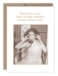 The "Friday Just Called Birthday Card" by Shannon Martin Design showcases a vintage aesthetic with a black-and-white photograph of a woman on a rotary phone, seated in a wicker chair. The card's text playfully announces, "Friday just called. She'll be here tomorrow and she's bringing wine." It is printed on recycled paper and comes with a Kraft envelope for an added nostalgic touch.