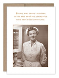 The Best Medicine Get Well Card by Shannon Martin Design, from an award-winning collection, showcases a smiling nurse in uniform in a medical setting. Printed on recycled paper, the card humorously states, "People who think laughter is the best medicine apparently have never had chocolate.