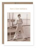Sepia-toned vintage photo of a person in a sailor‚Äôs cap and pants, standing confidently on a boat. The text above reads, "I run a tight shipwreck." This nostalgic scene is beautifully captured on recycled paper by Shannon Martin Design, adding an eco-friendly touch to your collection with the Tight Shipwreck Birthday Card.