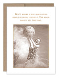 A sepia-toned image of a person in a patterned swimsuit joyfully holding a beach ball while standing in ocean waves, featured in our award-winning Make Waves Birthday Card collection by Shannon Martin Design. The text above reads, "Don't worry if you make waves simply by being yourself. The moon does it all the time.