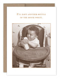 The award-winning *Another Bottle Baby Card* by Shannon Martin Design features a sepia-toned photo of a smiling baby in a high chair holding a bottle. Above, the text humorously declares, ‚ÄúI‚Äôll have another bottle of the house white,‚Äù giving a whimsical nod to wine culture reminiscent of vintage photography.