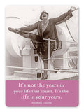 With a joyful pose on a ship, one leg raised high and a beaming smile, this person epitomizes the spirit captured by the "Years In Your Life Magnet" from Shannon Martin Design: "It's not the years in your life that count. It's the life in your years." - Abraham Lincoln.