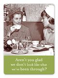 Two women sit at a table in a vintage setting, enjoying a conversation. One has a teacup in hand, and the table, resembling organized file cabinets, is adorned with drinks and a slice of cake. The image includes the text from Shannon Martin Design's "Aren't You Glad Magnet": "Aren‚Äôt you glad we don‚Äôt look like what we‚Äôve been through?