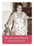 A vintage photo from Shannon Martin Design's "You Will Not Win Magnet" features a woman with glasses and a patterned apron standing confidently in a kitchen, her hand resting on a jar with fridges nearby. Beneath the image, a red banner states: Do not start with me. You will not win.