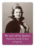 A retro-themed image of a woman, her hair elegantly curled and adorned with a flower crown, dressed in a black coat with an upturned collar. She exudes confidence, reminiscent of someone standing before lockers. The bottom features purple text: "We can't all be Queen. Someone needs to bow as I go by." This product is the "Be Queen Magnet" by Shannon Martin Design.