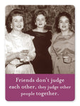 Three women in vintage attire stand together, smiling and holding drinks against a backdrop of colorful lockers. A caption below reads, "Friends don't judge each other, they judge other people together," featuring the Judge Other People Magnet by Shannon Martin Design.