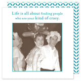 The Shannon Martin Design "Kind Of Crazy Beverage Napkin" features a vintage photo of cheerful people in humorous hats, ranging from balloons to paper, surrounded by the text: "Life is all about finding people who are your kind of crazy." Set against a teal chevron background, these biodegradable napkins are an ideal choice for whimsical gatherings and make perfect hostess gifts.