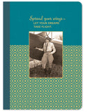 The Take Flight Journal by Shannon Martin Design features a vintage aviator by a biplane on the cover with gold foil accents. The text Spread your wings, let your dreams take flight appears above, set against a teal background and patterned lower section.